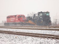 CP PLOW-04 with CP 5920 for power, jordan spreader CP 402894 being pushed, heading up to Midhurt to pick up a foremen then start plowing the sidings on northern portion of Mactier sub. 