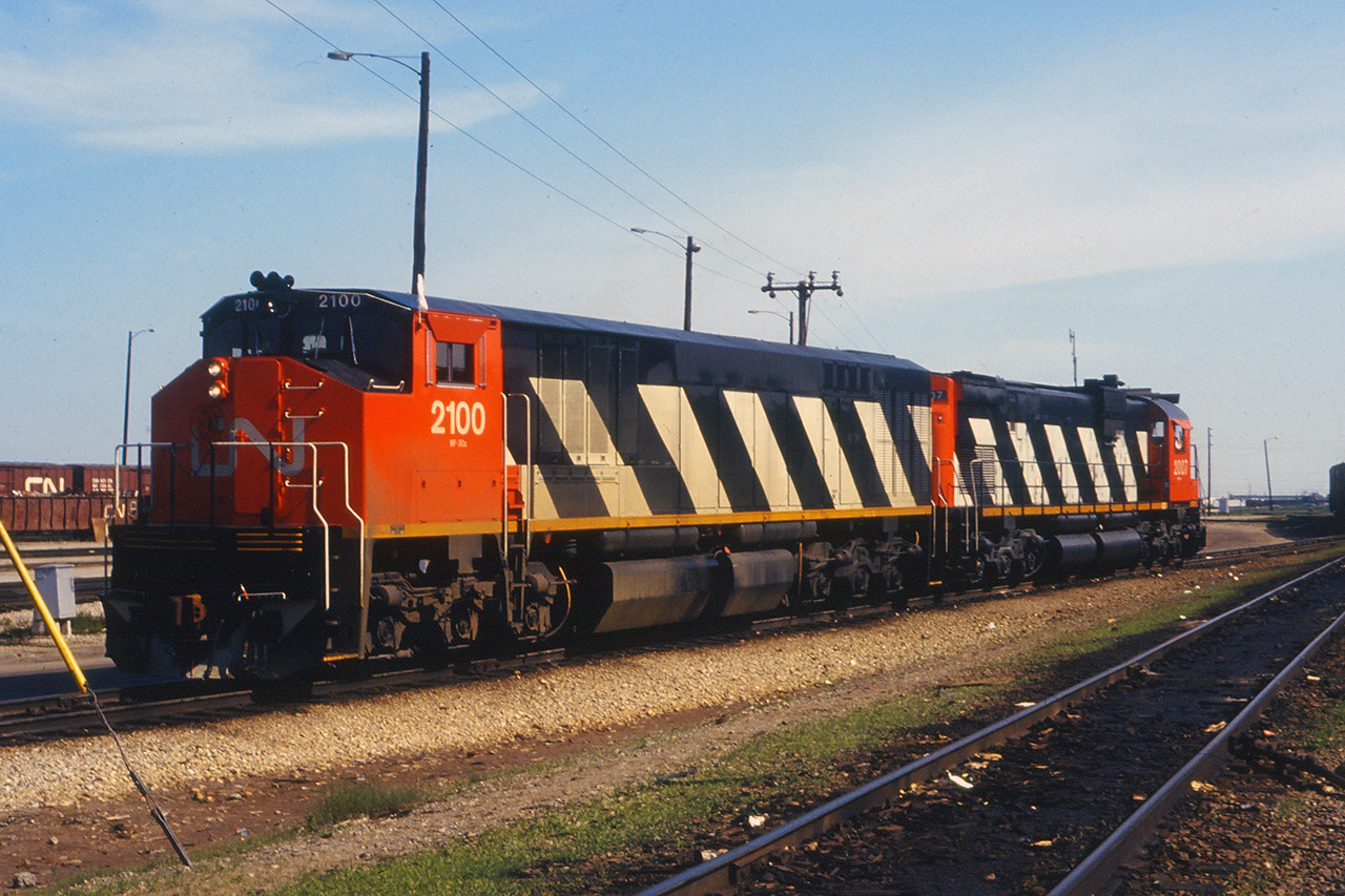 Sitting in the "Pocket" at east control, 2007 and 2100 will shortly pull out and tie onto their train for a brake test and departure. The yard job is just shoving back to fill another track at East Control as the constant parade of assembly and departure goes along 24/7. I'm standing between E1 and E2...the longest departure tracks in East Control at the time. I guess technically they still are as C49-53 now extend into the reduced L yard as giant double over and storage tracks.