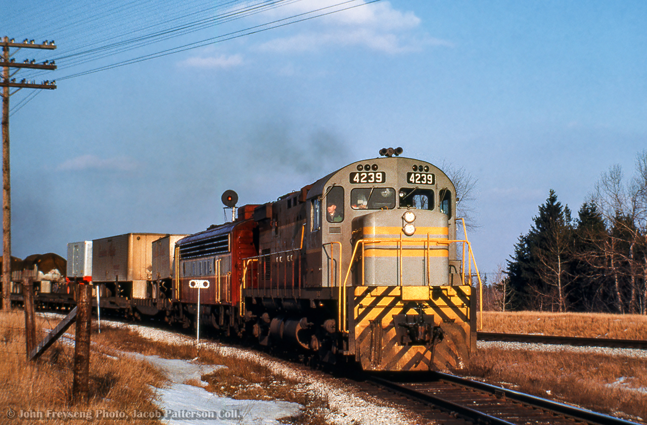 CPR 903 from Montreal takes the switch from the Belleville Sub onto the Staines Lead with an MLW C424 and GMD 4000-series FP7A on the headend.

John Freyseng Photo, Jacob Patterson Collection Slide.