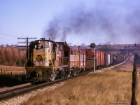 CPR Extra 8764 west climbs the grade approaching the Highway 6 overpass at Puslinch.

<br><br><i>Scan and editing by Jacob Patterson.</i>