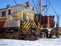 CPR 8917, a CLC H24-66 built in 1956 sits alongside leased Boston & Maine ALCO RS3 1511.  Per Bruce Curry's article in the <a href=https://www.bytownrailwaysociety.ca/index.php/branchline/branchline-pdf-files/file/241-1992-02>February 1992 issue of Branchline,</a> 1511 was one of four RS3s on lease from the B&M (among other units), from September 16, 1965, through June 11, 1967.  The three others being the 1535, 1536, and 1540.

<br><br>More B&M leasers on CP:
<br><a href=https://www.railpictures.ca/?attachment_id=37590>Woodstock, May 1966 by Bill Thomson</a>
<br><a href=https://www.railpictures.ca/?attachment_id=37659>Woodstock, summer 1966 by Bill Thomson</a>
<br><a href=https://www.railpictures.ca/?attachment_id=37635>Campbellville, May 1970 by Doug Page</a>
<br><a href=https://www.railpictures.ca/?attachment_id=37636>Galt, July 1970 by Doug Page</a>


<br><br><i>Scan and editing by Jacob Patterson.</i>