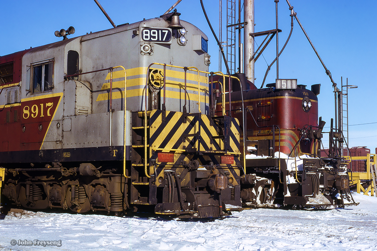 CPR 8917, a CLC H24-66 built in 1956 sits alongside leased Boston & Maine ALCO RS3 1511.  Per Bruce Curry's article in the February 1992 issue of Branchline, 1511 was one of four RS3s on lease from the B&M (among other units), from September 16, 1965, through June 11, 1967.  The three others being the 1535, 1536, and 1540.

More B&M leasers on CP:
Woodstock, May 1966 by Bill Thomson
Woodstock, summer 1966 by Bill Thomson
Campbellville, May 1970 by Doug Page
Galt, July 1970 by Doug Page


Scan and editing by Jacob Patterson.