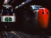 GO train 915 has just arrived at Toronto Union station with GMD GP40TC 603 pushing on the rear, pulling in alongside CN turbo train P101, which will be departing shortly for Montreal on a test run.
<br><br><i>Scan and editing by Jacob Patterson.</i>