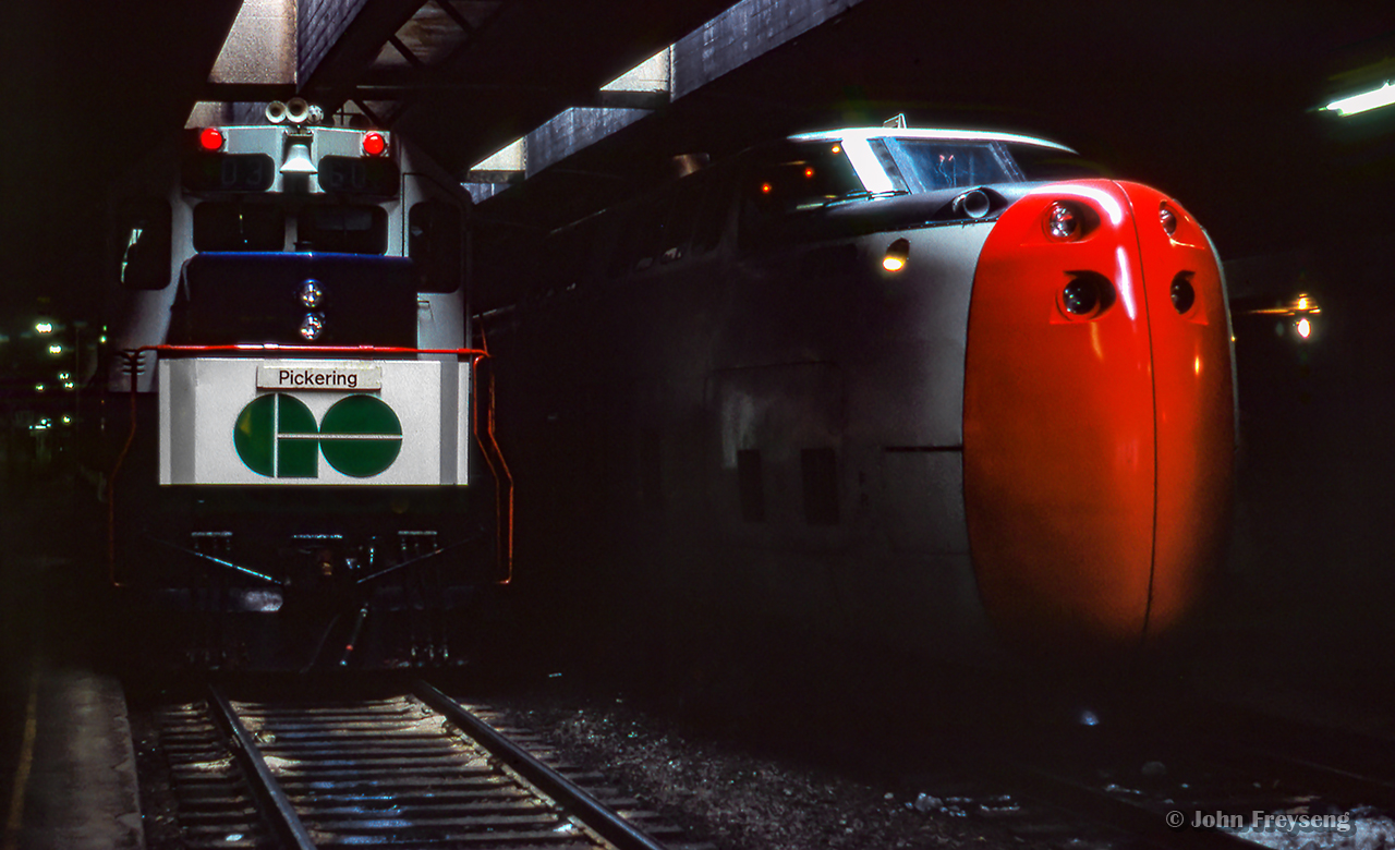 GO train 915 has just arrived at Toronto Union station with GMD GP40TC 603 pushing on the rear, pulling in alongside CN turbo train P101, which will be departing shortly for Montreal on a test run.
Scan and editing by Jacob Patterson.