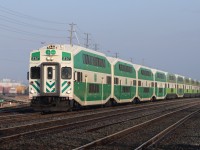 Westbound GO approaching Chartwell Road, Oakville with old style Cab Car GO 257 leading, sporting classic GO Transit livery.