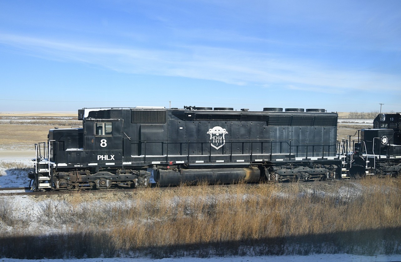 Parrish & Heimbecker 8  
As seen from VIA #1 The Canadian, PHLX 8 an SD40-2 sits powered down on its home storage track in Oban, SK at CN Oban East Mile 7.56 CN Wainwright Sub. on November 22, 2024.