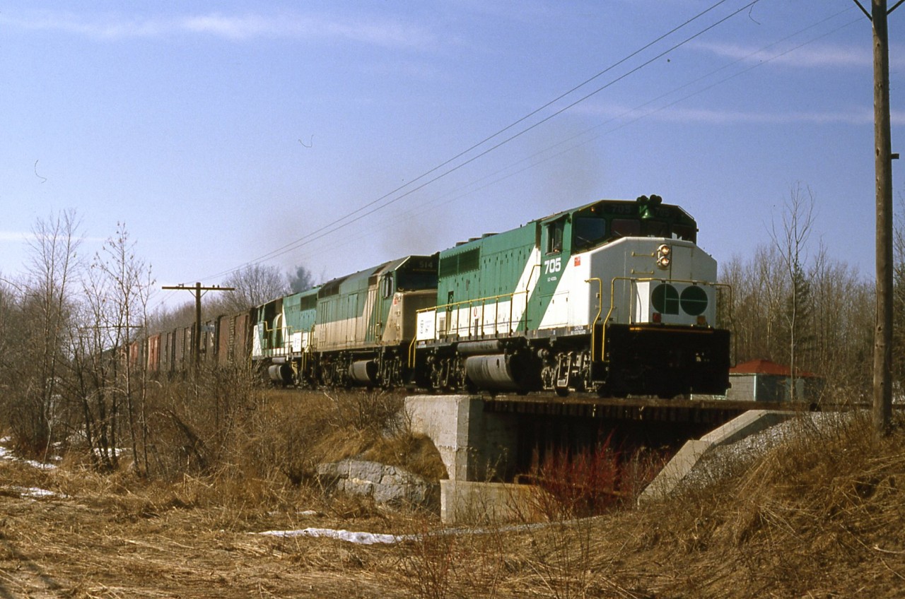 Go units on a grain extra from Port McNicoll passing thru Victoria Harbour