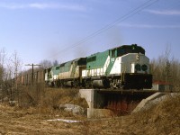 Go units on a grain extra from Port McNicoll passing thru Victoria Harbour