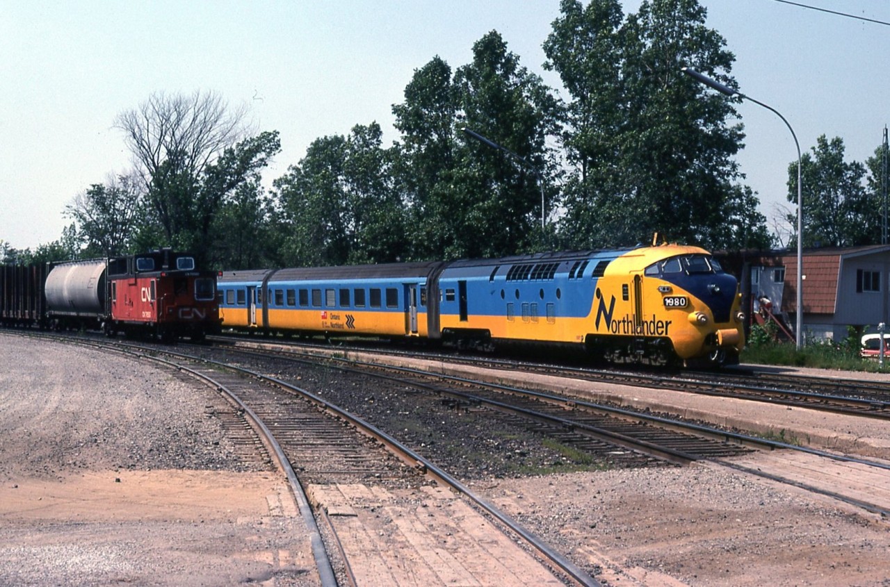 The Northlander passing CN freight southbound at Washago Station