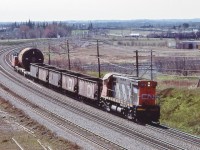 <br>
<br>
 CN Extra 3209 East  with a dimensional.
<br>
<br>
 ..from the removed Hopkins Street overpass, April 27, 1985 Kodachrome by S.Danko
<br>
<br>
This Kodachrome had me scrambling ...so many changes...
<br>
<br>
TIME MACHINE
<br>
<br>
  Only the outlines of the roofs of three dwellings are identifiable in all four images: look closely, far distance upper left
<br>
<br>
  Darrell's  March 1989 capture
<br>
<br>
     <a href="http://www.railpictures.ca/?attachment_id=  22215 ">  Extra 3500 East   </a>
<br>
<br>
  The 1991 view
<br>
<br>
     <a href="http://www.railpictures.ca/?attachment_id=  47423 ">  Skyline 504   </a>
<br>
<br>
And the October 2016 view, just prior to the overpass removal 
<br>
<br>
     <a href="http://www.railpictures.ca/?attachment_id=  46002 ">  VIA  J train #52 / 62  </a>
<br>
<br>
OBTW:
<br>
<br>
CN 3209 is a Century:  1967 MLW built C-424, retired late 1980's, with 10 sisters to Mexico circa 1989.
<br>
<br>
sdfourty

