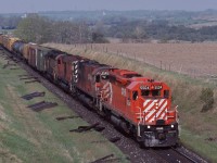 <br>
<br>
A common motive power practice, a CP Rail SD leading a pair of big M's.
<br>
<br>
Second #927,  through the Northumberland hills, on the grade approach Lovekin. 
<br>
<br>
On a glorious spring day, at the Newtownville overpass, May 11, 1985 Kodachrome by S.Danko
<br>
<br>
Power: #5504   - #4569 – #4727 – and a ubiquious Chessie. 
<br>
<br>
And in the distance, the pair of 'bee bridges' a k a Nichol's road overpasses 
<br>
<br>

