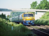 Hard to believe these BBD LRC-2 locomotives last saw service on the railroads back in 2001. Only 20 years (1981) from when they first appeared and now they are gone. And have already been gone over 20 years.   Speaks volumes, I'd guess, about their (lack of) reliability. I enjoyed seeing them, since they were replacing Tempo trains thru Bayview, and any of us out trackside in those days had seen enough of the Tempos.
VIA was the only outfit to order these LRCs; totaling 31 engines (6900-6930) and they also 100 coaches, many of which are still seen along the lines. Two locomotives, 6917 and 6921 survive; the rest have been scrapped.
This image is of which I believe #70 (lost my notes) judging by the sun angle, rolling eastward under the "Railfans Walk bridge" at the Botanical Gardens just east of Bayview Junction. Beautiful day and not a soul on the bridge.