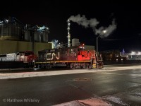 CN's 1500 Hamilton Yard Job is seen shoving 11 hoppers into the Bayside track at Bunge's canola facility with 7058-9449-9461 for power.