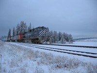 January 11, 2006, we were in the siding at Wright BC along the shore of Lac La Hache waiting for a southbound train. BCOL 4648 leading a trio of locos, and way back in the train was another 3 unit DPU set, unfortunately my image of the DPU's was way too blurry to post.. CN in their PSR wisdom was running some monster trains on BC Rail from Prince George south, generally 3 units on the headend and a trio of MU'd  DPU units mid-train. It was a gloomy afternoon for photos. 