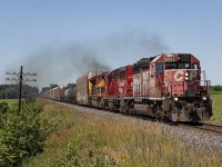 The "CP Rail System" returned for Canada Day of 2024!  
<br>
CPKC 2-H92 (although it was reported with various other symbols) hauls through Thamesford just after 11 AM with the "rescue" unit for 135 a few days prior - 'Dual Flag' SD40-2 #5743.  I and many others thought for sure that this unit would have been wyed in Windsor or Detroit for the return trip east - but somehow, it emerged out of Walkerville Junction just after 6 AM in the lead position of (at the time) 134.  This was a good day to not sleep in.  This was one of two mainline SD40-2 leaders in the year for London and the surrounding area.  It was great getting to see everyone out and about for this one.
<br>
July 1, 2024.