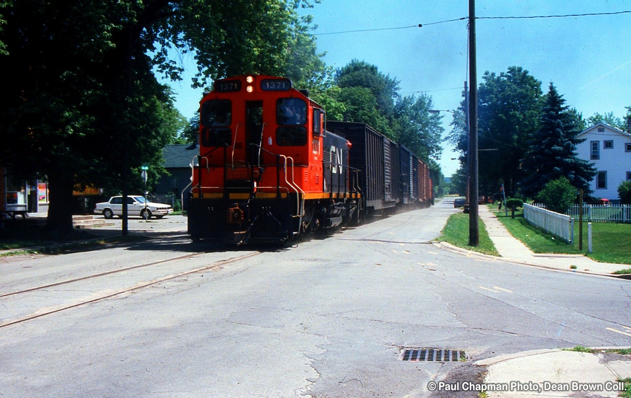 549 with CN SW1200RS 1371 heading up the Townline Rd. on the CN Townline Spur for Interlake Paper.