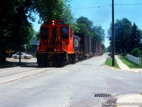 549 with CN SW1200RS 1371 heading up the Townline Rd. on the CN Townline Spur for Interlake Paper.