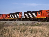 A short unit train of sulphur was passing the north switches to the siding and elevator tracks at Gibbons. For trains heading home, Gibbons was the last town you passed through. In a half hour or so, Edmonton will have become the dominant feature on the horizon. Now for something completely different, (for those that like numbers). Total the numbers on the lead unit, 4+6+0+2=12, do the same for the other 2. You end up with 12, 13 and 14. Seems these units were in their natural order. :-)