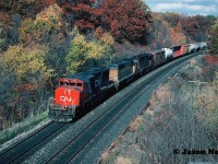 During a now sunny late fall afternoon, a CN westbound powered by SD40-2(W) 5362, a former Union Pacific SD40-2 (now CN) and a GP40-2L(W) is viewed approaching Bayview Jct. in Burlington, Ontario on the Oakville Subdivision.