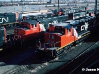 CN SD40-2(W) 5363 and GP40-2L(W) 9444 show off their somewhat still fresh CNNA colors as they wait to depart the MacMillan Yard diesel shop tracks amongst a sea of other motive power in Vaughan, Ontario. 