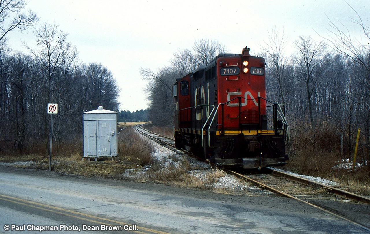 CN 550 with CN SW1200RM 7101 heads northbound at Merrittville Hwy on the CN Fonthill Spur after serving the Fonthill Lumber.