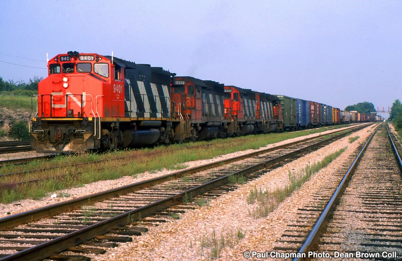 386 with CN GP40-2(W) 9401, CN GP40 9313, 9312, 9314 at Duff.