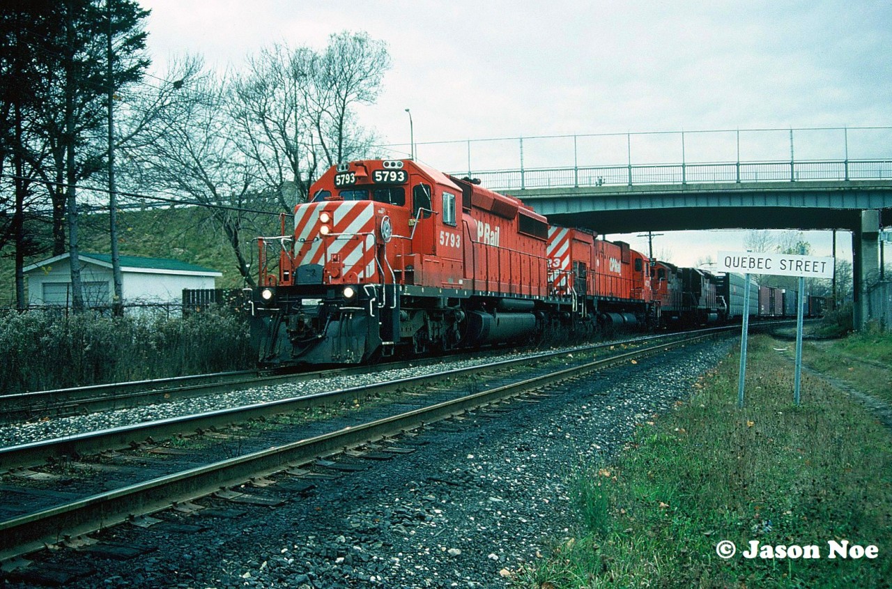 During a November morning an eastbound CP train is viewed departing the Quebec Street Yard in London, Ontario.  The consist included; SD40-2 5793, M-636 4723, GP9u 8207 and SD40-2 5482. High-hood 5482 was ex-NS 3252 and nee-Southern Railroad 3252.