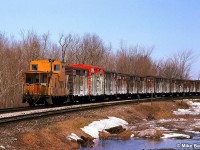 NB CP train trailing a large cut of stock cars. Something not seen since containers became popular.