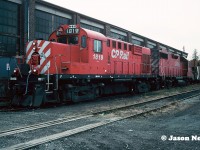 CP RS-18u 1819 and GP38-2 3038 wait between assignments at CP’s Aberdeen Yard in Hamilton, Ontario with a caboose. Not many CP GP38-2’s were repainted in the action red paint minus the multi-mark prior to the duel flags paint scheme being introduced in 1993. 