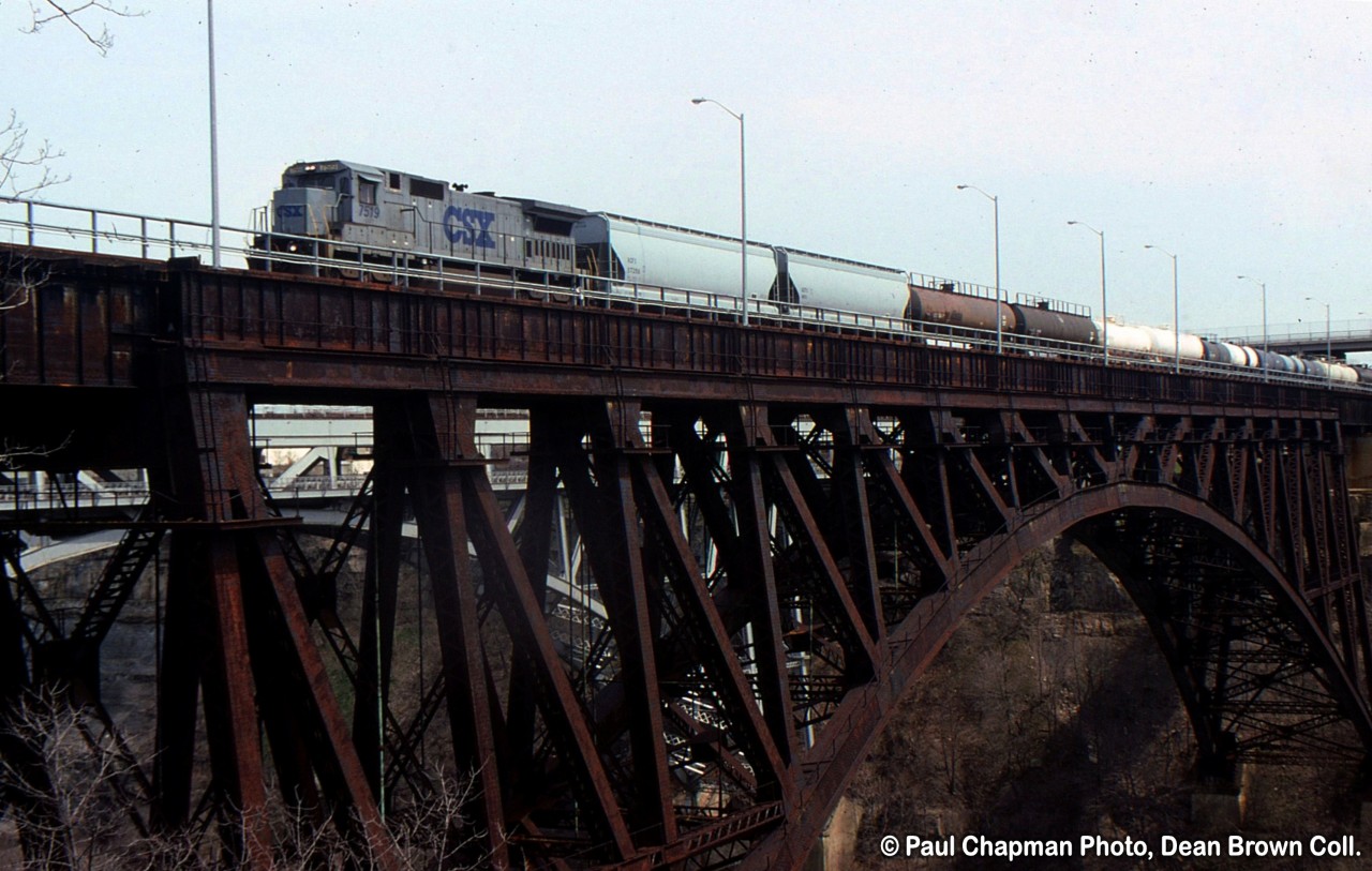 CSX 321 with CSX C40-8 7517 heads northbound over the Suspension Bridge in Niagara Falls.