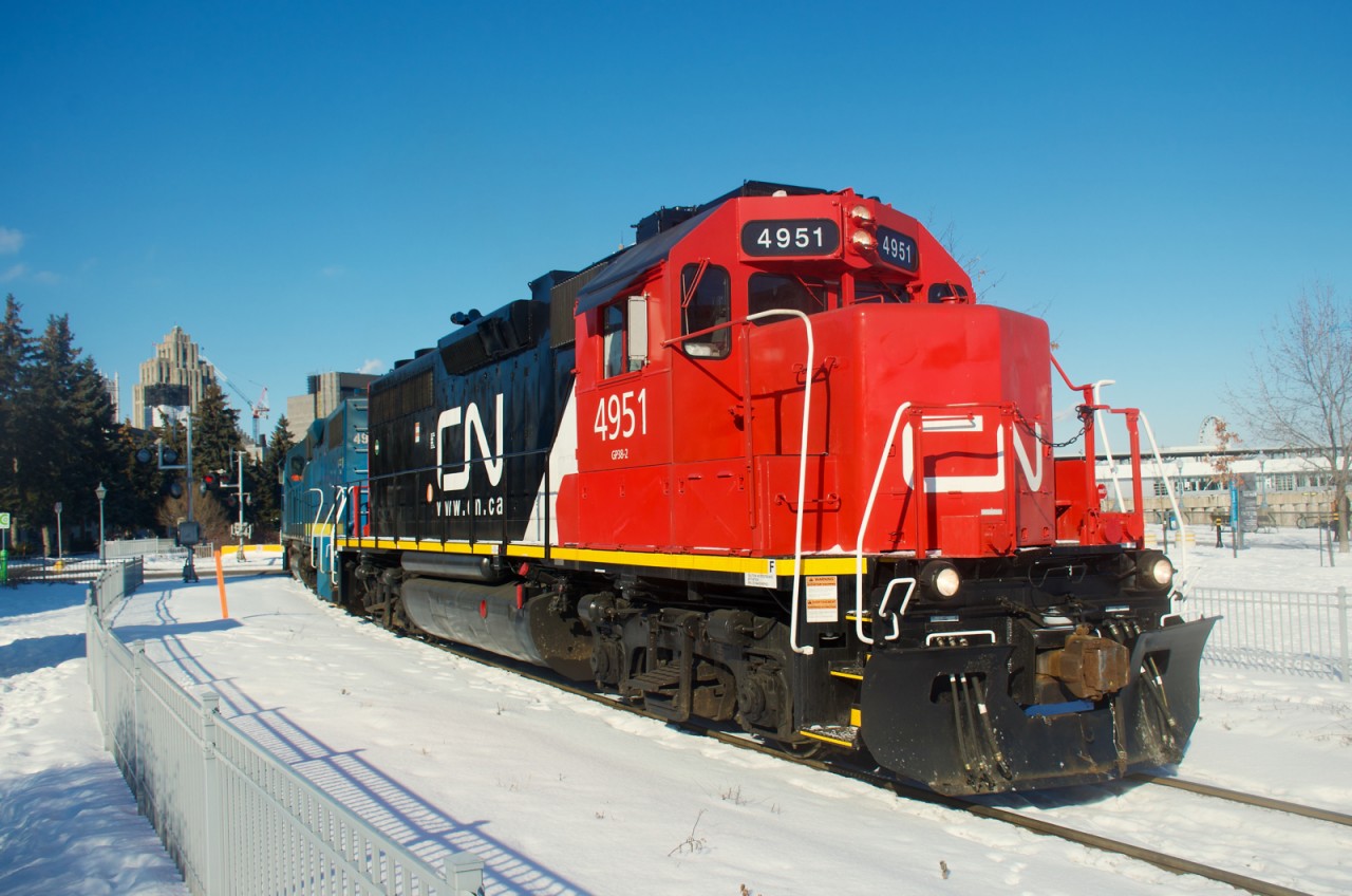 CN 4951's paint pops in the sun and snow as it leads CN 500 out of the Port of Montreal.