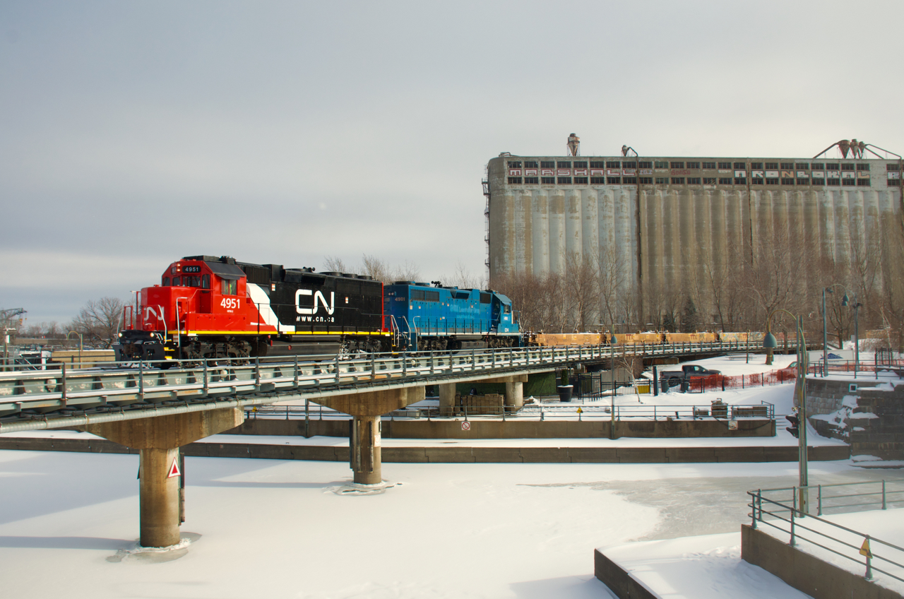 New to the CN roster, CN 4951 leads CN 500 into the Port of Montreal. After a number of very cold and snowy days, the Lachine Canal is frozen solid.