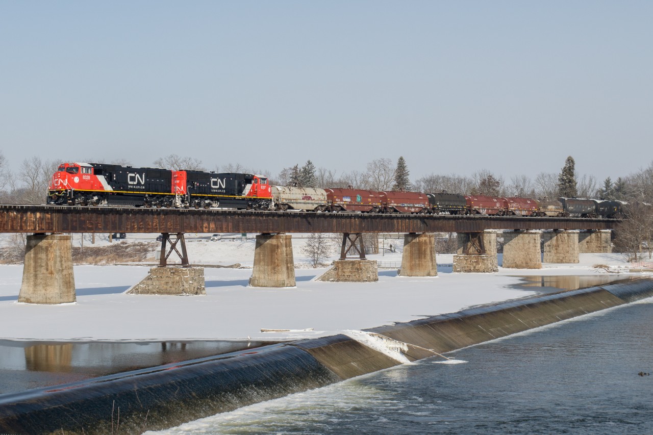 CN 8328 and CN 8317 lead CN L502 across the Grand River in Caledonia.  These two SD75iACC rebuilds are on what I believe was their second revenue run after bringing CN 492 into Sarnia last night.  CN 8328 is the form CN 5707 and CN 8317 is the former CN 5664