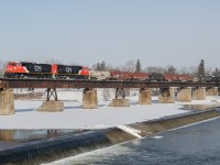 CN 8328 and CN 8317 lead CN L502 across the Grand River in Caledonia.  These two SD75iACC rebuilds are on what I believe was their second revenue run after bringing CN 492 into Sarnia last night.  CN 8328 is the form CN 5707 and CN 8317 is the former CN 5664