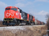 CN L502 is on the last leg of their trip from Sarnia to Garnet as they approach the grade crossing at Sandusk Road.  Leading the train is brand new SD75iACC's 8328 and 8317.