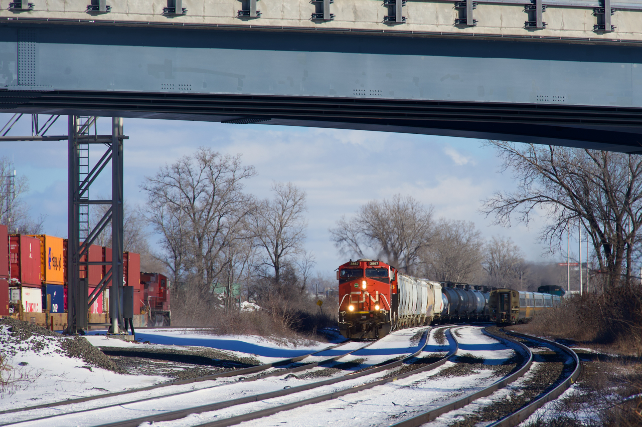 CN 369 approaches Dorval Station as CPKC 114 and VIA 62 head east.