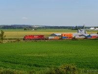 Intermodal traffic bound for the west coast is stretched out across the New Tecumseth countryside as CPKC 113 approaches the south end of Baxter.