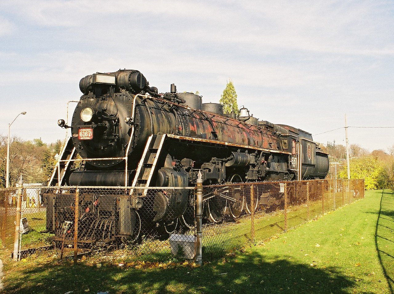 In my working days, construction site visits gave me the opportunity to do some railfanning in places I wouldn't normally get to. While I would take the direct route to get to the meeting, I usually took the scenic route home. Here we see CN 6167 looking pretty rough sitting on the north side of the tracks near the Guelph train station. The engine was cosmetically restored around 2010 and moved to the south side of the tracks. In 2020 it was moved again to John Galt park. My previous encounter with this engine was a glimpse from the window of an excursion being pulled by 4-8-4 #6218 in 1968.