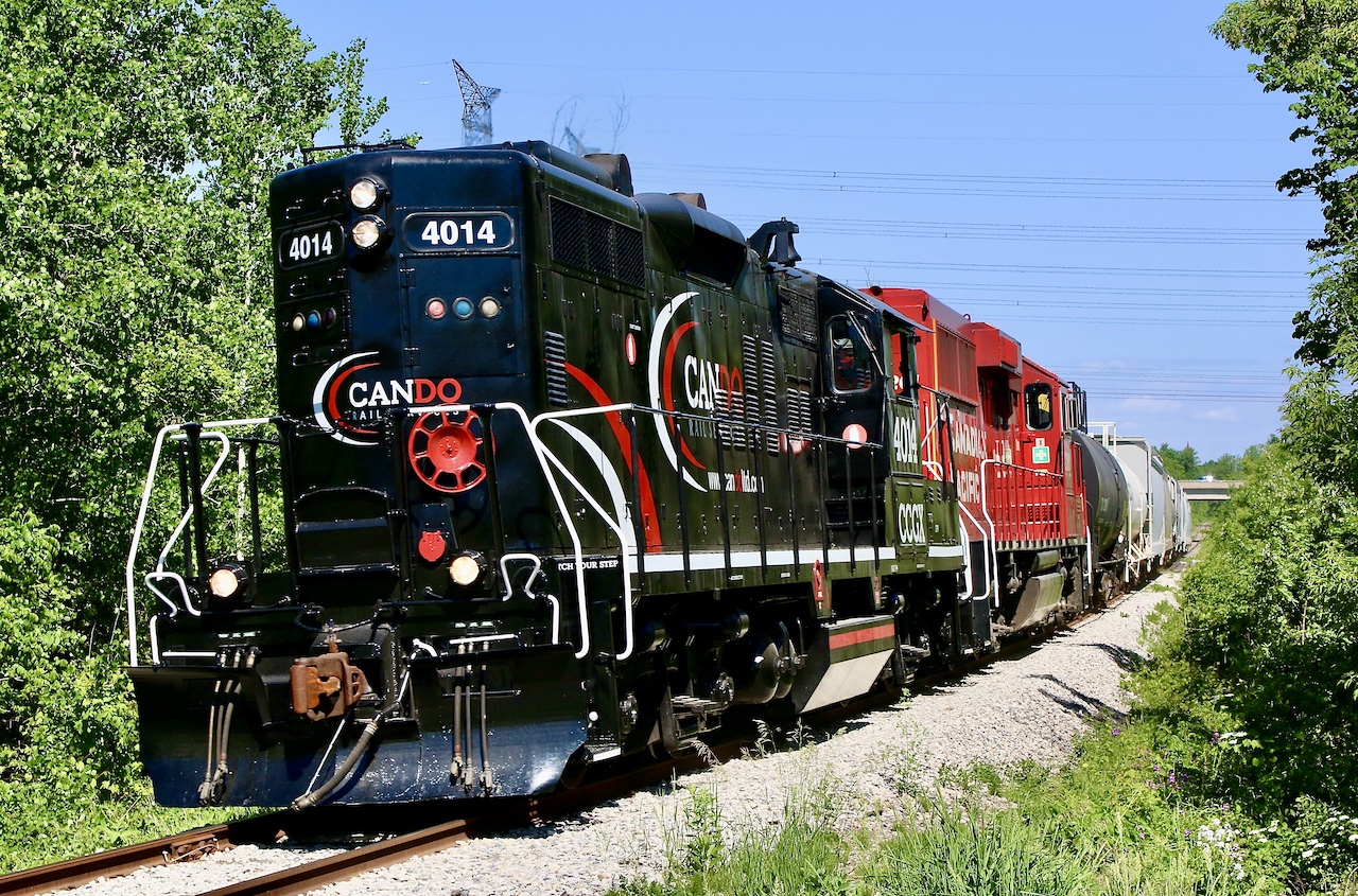 For a brief time after CCGX 4014 arrival, borrowed CP 2261 was paired up with it incase mechanical issues arose. Here the pair are seen heading southbound at Meadowvale after crossing the Credit River. The train is about to cross Derry Road. Today the rails here are still intact but unlike go ever see the passage of a train again.