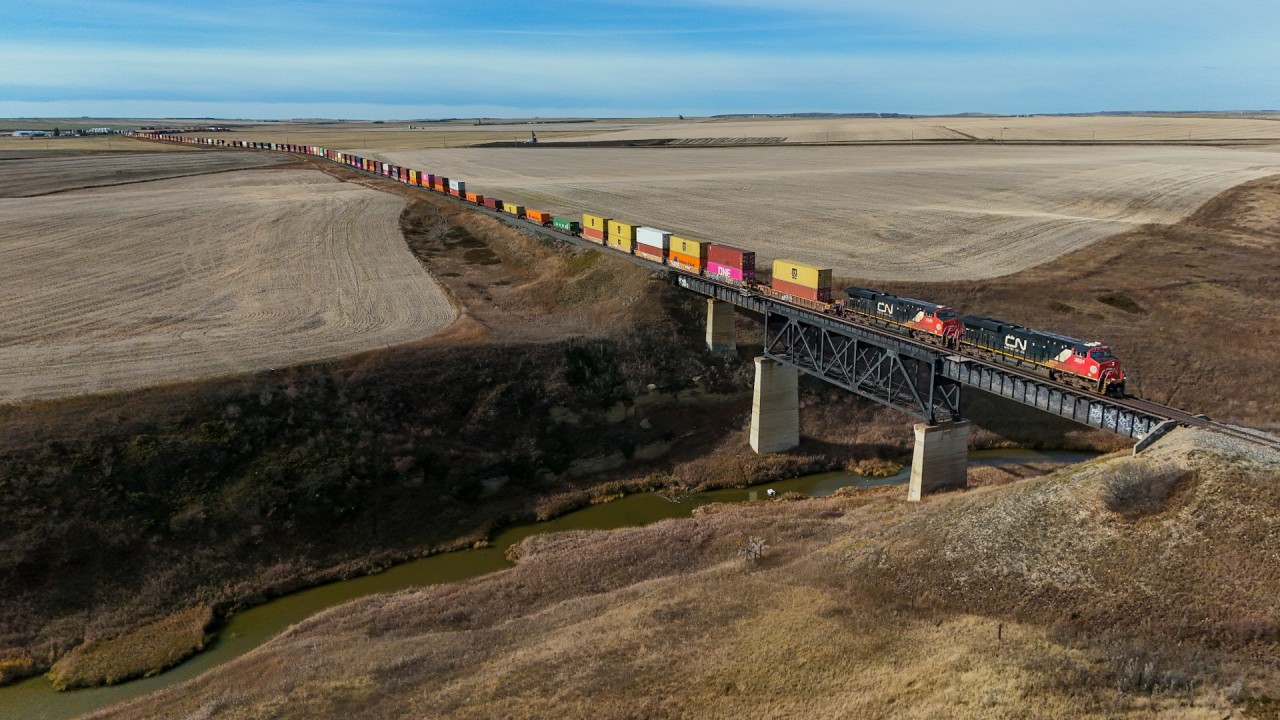 After a meet with Z 11531 15 at Perks, CN 3821 leads train Q 14751 18 across the Three Hills Creek as they head north to Mirror and eventually Vancouver.