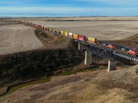 After a meet with Z 11531 15 at Perks, CN 3821 leads train Q 14751 18 across the Three Hills Creek as they head north to Mirror and eventually Vancouver. 