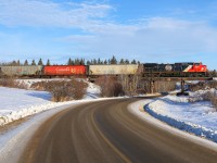 Retro Logo CN 3331 climbs the grade out of Sherwood Park with a grain train for Humboldt. 