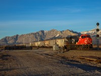 At a classic Canadian Pacific location, CN 2880 east blasts through Ozada with an empty grain train just moments after sunrise.  