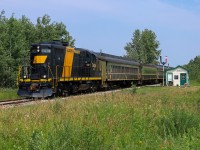 Alberta Prairie train 26 rolls into Warden, past a refurbished Canadian Northern Railway station.  Check out the comment section for some links of this unit in various schemes. 
