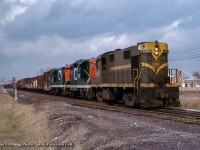 Three units from three builders.  An MLW RS18/GMD GP9/CLC H16-44 consist lead extra CN 3885 south on the approach to Doncaster where it will swing west onto the York Sub and head for Mac Yard.

<br><br><i>John Freyseng Photo, Jacob Patterson Collection Slide.</i>