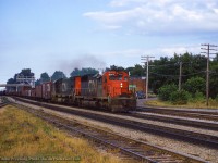 On a summer evening at Georgetown, CN extra 5060 west approaches the small yard and station area.

<br><br><i>John Freyseng Photo, Jacob Patterson Collection.</i>