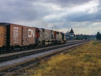 On a summer evening at Georgetown, CN extra 5060 west approaches the small yard and station area.

<br><br><i>John Freyseng Photo, Jacob Patterson Collection.</i>