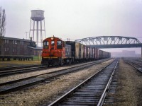 CN 7025 leads a string of boxcars on transfer to Buffalo towards the International Bridge.

<br><br><i>Scan and editing by Jacob Patterson.</i>