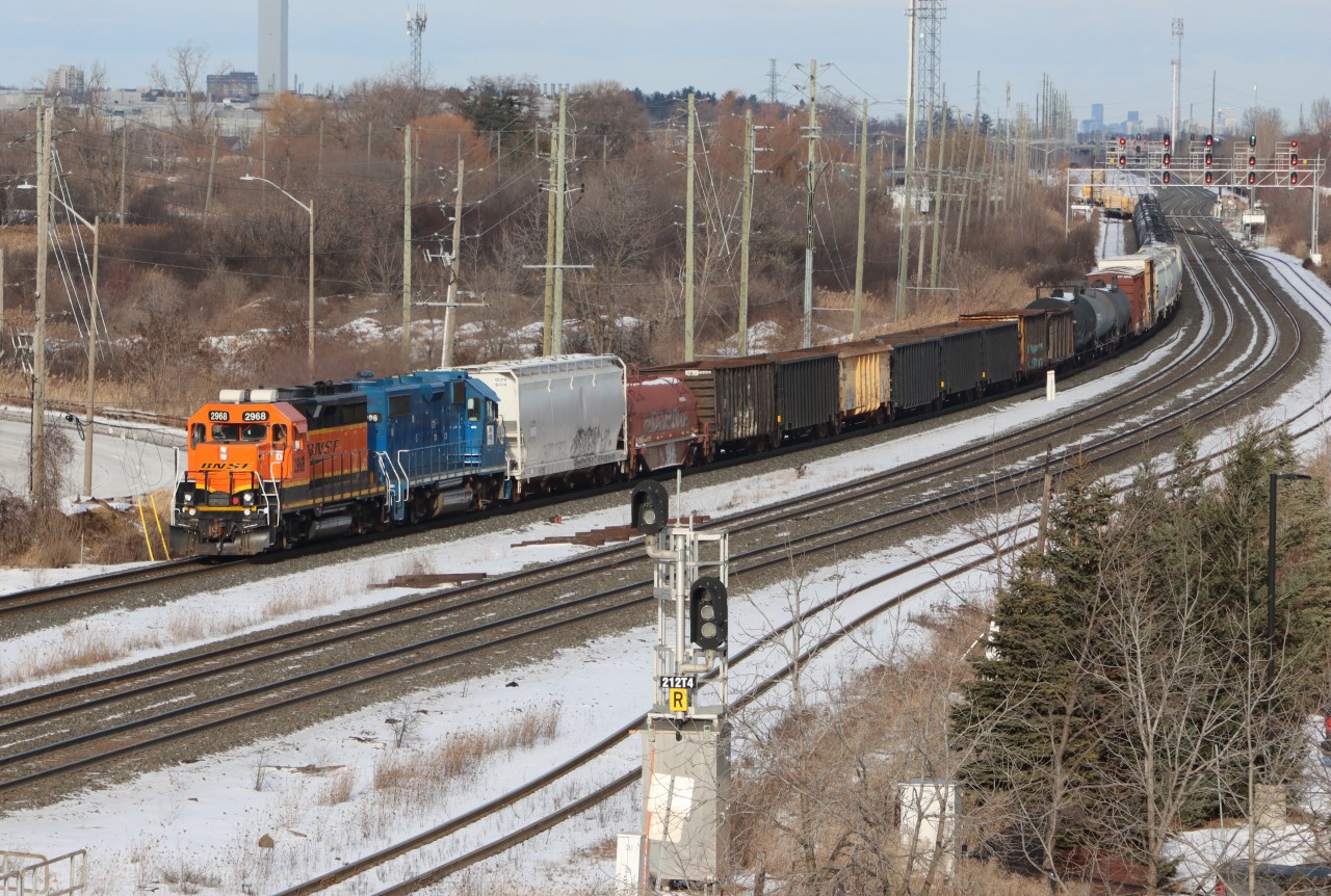 L554 departing Oakville Yard onto Track 1 with BNSF 2968, CN 4908 and 74 cars trailing.