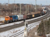 L554 departing Oakville Yard onto Track 1 with BNSF 2968, CN 4908 and 74 cars trailing.